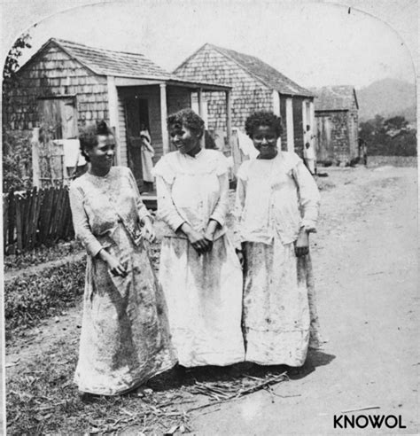 Three native Puerto Rican women in front of their hut houses - KNOWOL