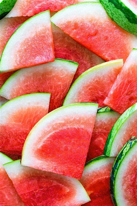 slices of watermelon and cucumber arranged on a plate