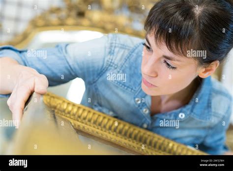 woman restoring window frame in atelier Stock Photo - Alamy