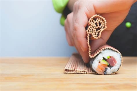 Rolling Up Sushi Stock Photo - Download Image Now - iStock