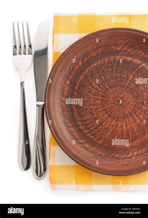 plate, knife and fork at napkin on white background Stock Photo - Alamy