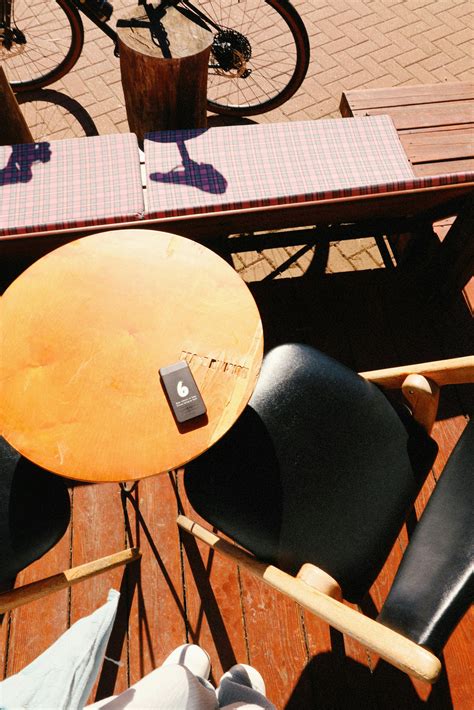 sunny outdoor cafe seating  garden view  stock photo