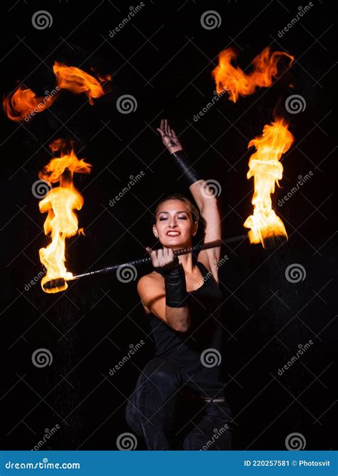 Firedancer. Sexy Woman Perform Fire Tricks In Darkness. Fire