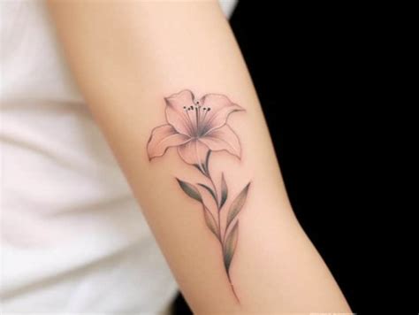 The Significance of Lily Tattoo Meanings + Designs