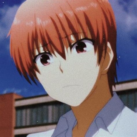 an anime character with red hair staring at the camera