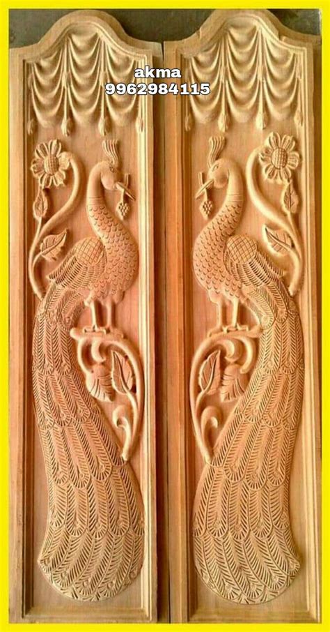 intricately carved wooden door  peacocks double door peacock