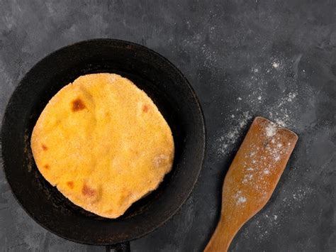 homemade flatbread meal frying pan corn flour rolling pin handmade