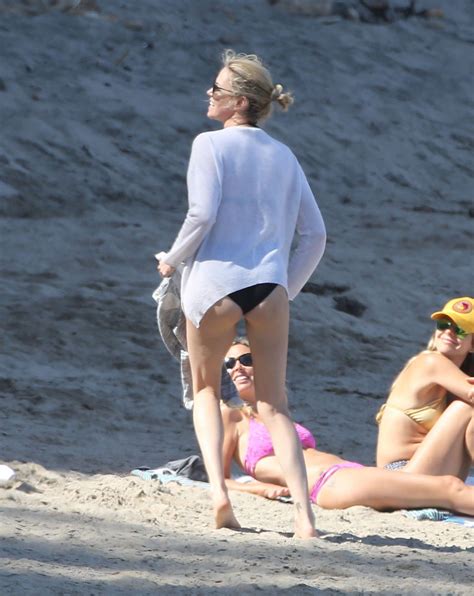 Charlize Theron - On the Beach in Malibu - April 2015 • CelebMafia
