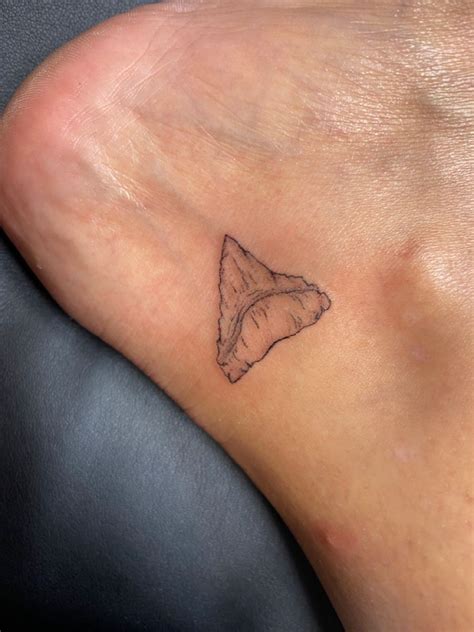 Shark Tooth Tattoo | Shark tooth tattoo, Tooth tattoo, Shark tattoos