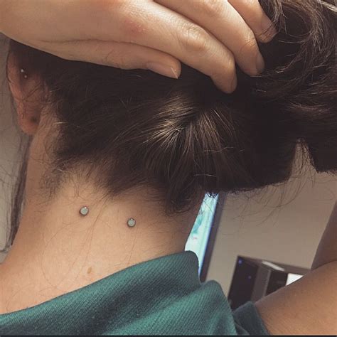 nape piercing surface barbell face piercings nape piercing piercing