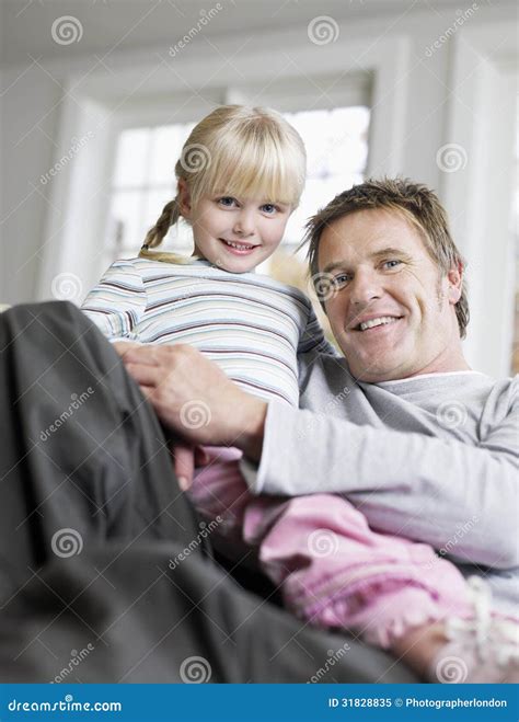 Girl Sitting on Father S Lap in House Stock Image - Image of father