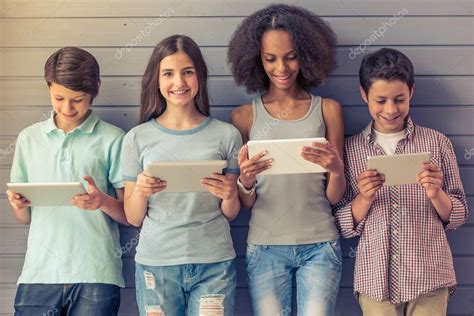 Teenagers with gadgets — Stock Photo © GeorgeRudy #113868504