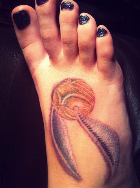 My newest tattoo. Golden Snitch from Harry Potter. | Snitch tattoo, Golden snitch tattoo, Tattoos