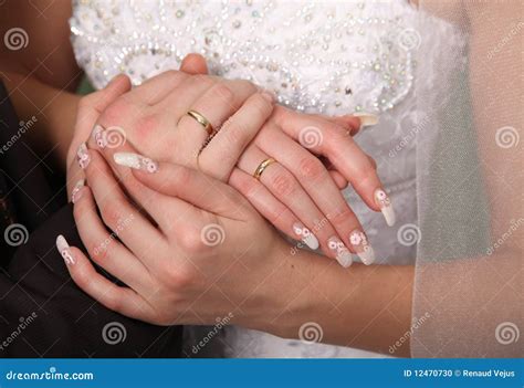 Hands with wedding rings stock photo. Image of colour - 12470730