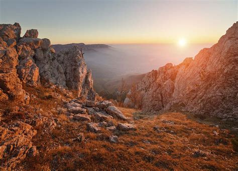 A rocky mountains with a sunset - Magic Decor