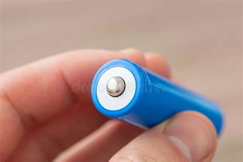 man holding   type battery  hands stock photo image