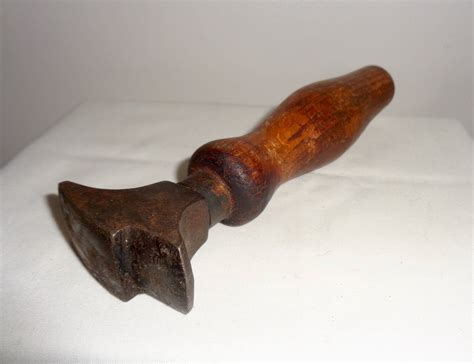 Any idea what this Vintage Small Hand Tool With Wood Handle & Anvil