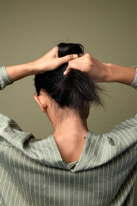 Back view of woman tying her hair Pinterest banner