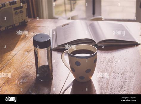 drinking coffee   kitchen stock photo alamy