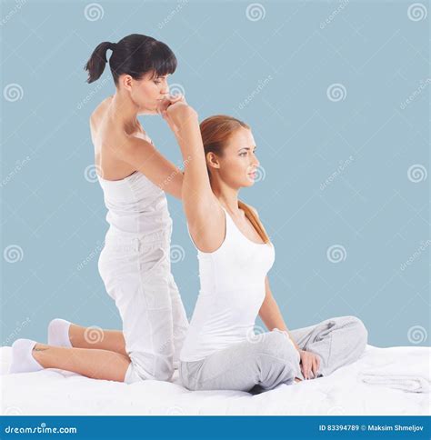 Woman on a Thai Massage on a Cyan Background Stock Image - Image of