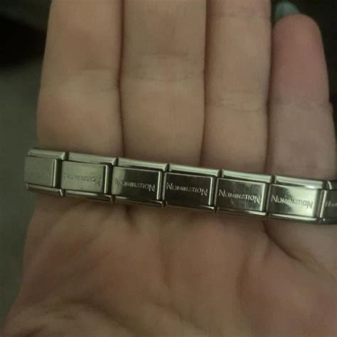 Nomination bracelet, 16 links, 2 charms - Depop