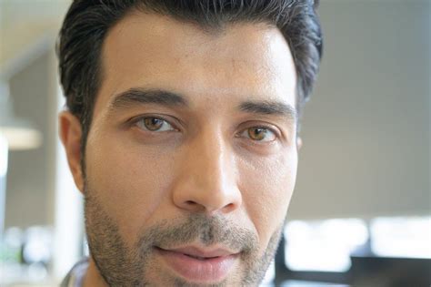 Close up of smiling middle east arab man eyes and face with bear – Artofit