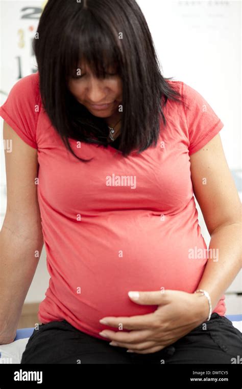 Pregnant woman pain Stock Photo - Alamy