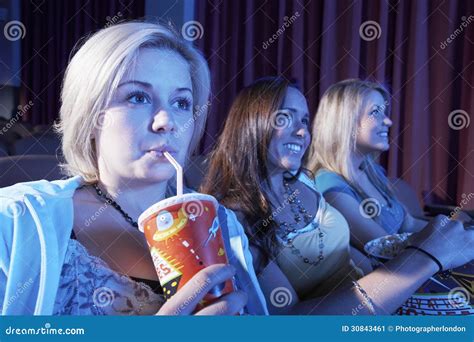 Woman Drinks Soft Drink with Friends Watching Movie in Theatre Stock ...