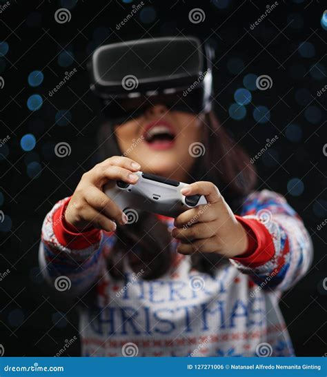 Excited Asian Girl Playing Video Games with Virtual Reality Dark Stock