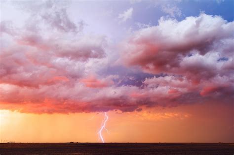 premium photo lightning strikes   colorful sunset sky