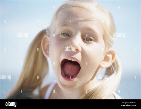 Girl with mouth wide open Stock Photo - Alamy