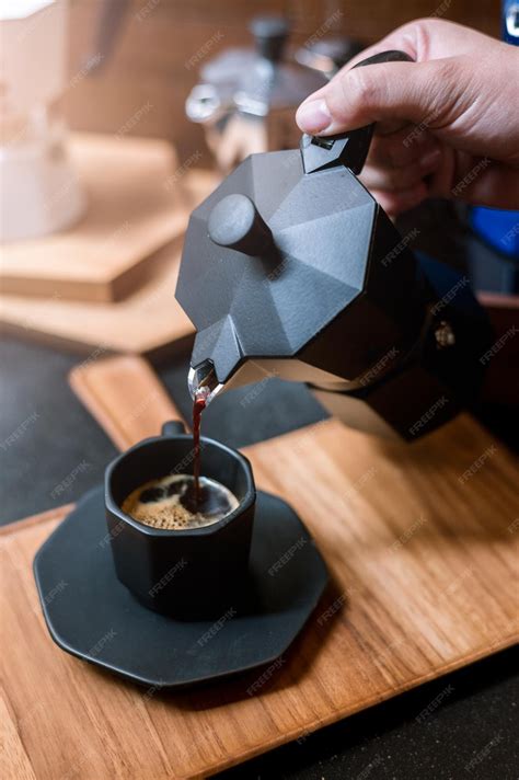 Premium Photo | Baristas use coffee pots to pour coffee in a glass