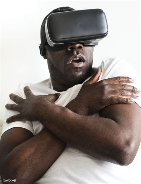 Black man experiencing virtual reality with a VR headset | premium