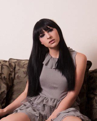 Tranny pinup babe Bailey Jay enjoying a smoke Porn Pictures, XXX Photos