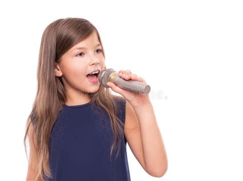 Little Girl Posing with a Microphone for Singing on White Background ...