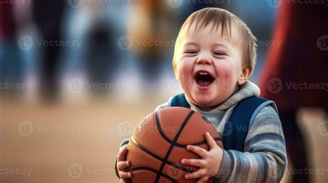 Little boy with down syndrome holding a basketball 26812608 Stock Photo at Vecteezy