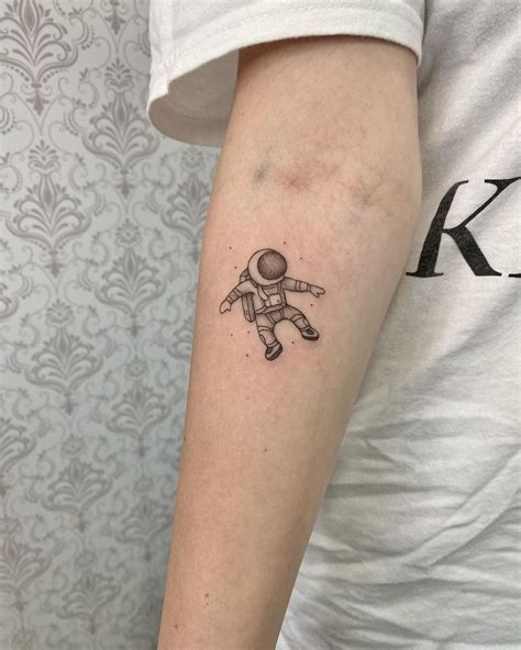 Spaceman Tattoo | Astronaut tattoo, Small tattoos for guys, Palm tattoos