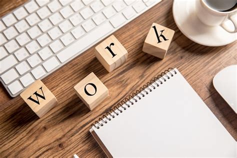 premium photo notepad keyboard work   cup  coffee