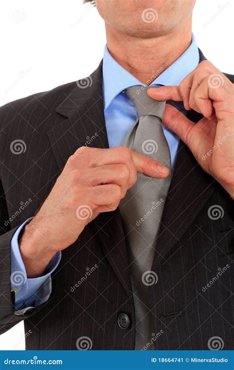 Businessman adjusting tie stock image. Image of corporation - 18664741