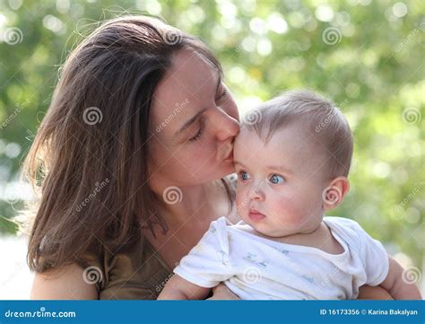 Mom Kissing Baby Stock Photo | CartoonDealer.com #45103482