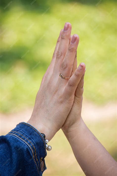 Premium Photo | Family members holding hands while they walk through