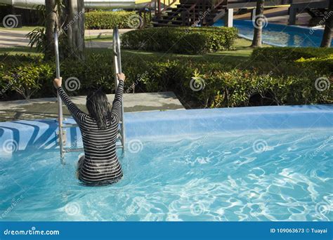 thai women swimming  playing water  pool  outdoor stock image