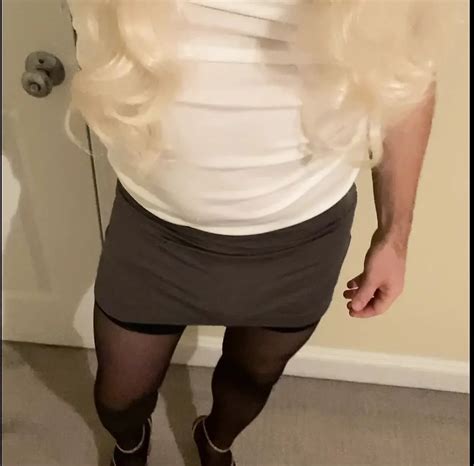 Crossdresser flaunting by walking around in short skirts and dresses