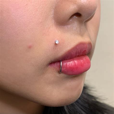 lip piercing pain cost aftercare tips