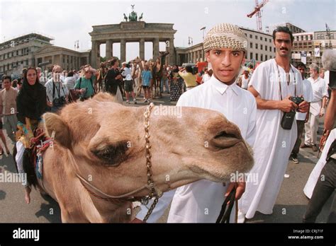 Kamel and his companion in front of the Brandenburg Gate in Berlin ...