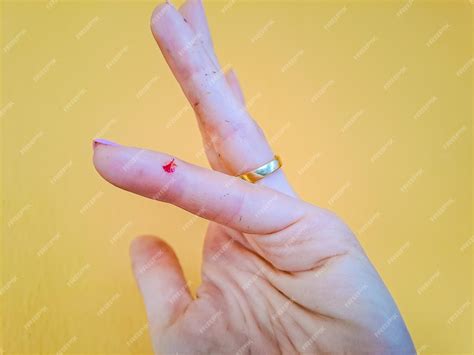 Premium Photo | Injured finger with bleeding open cut closeup of a womans cut finger in blood