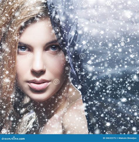 Portrait of a Young Naked Woman on a Snowy Background Stock Image