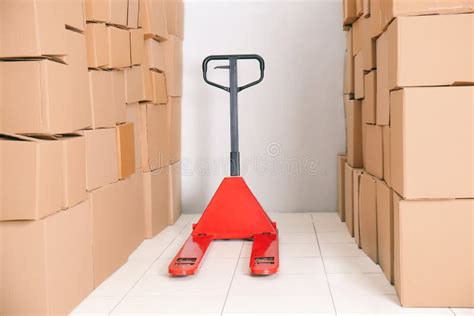 Manual Pallet Truck in Wholesale Warehouse Stock Image - Image of ...