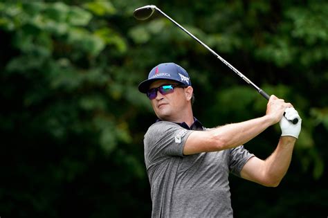 Download Zach Johnson Swinging A Black Club Wallpaper | Wallpapers.com
