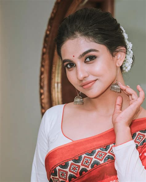 mamitha baiju malayalam actress  trendy fashion saree latest images